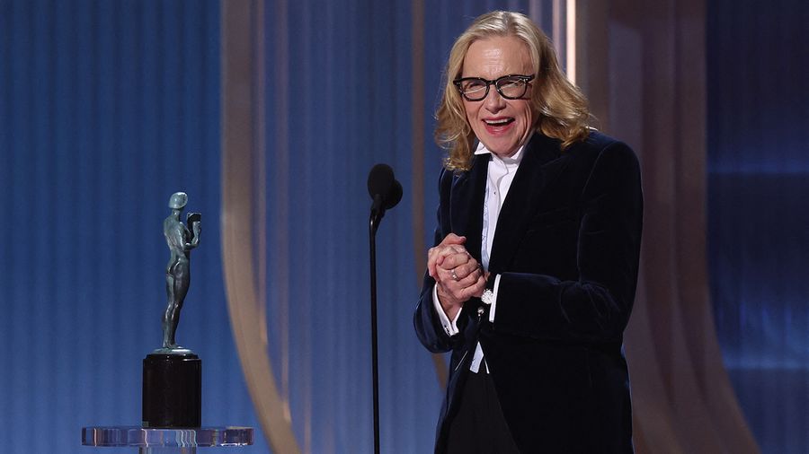 Amy Madigan accepting the 2026 Actor Award on stage